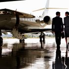 Two executives walking to private jet